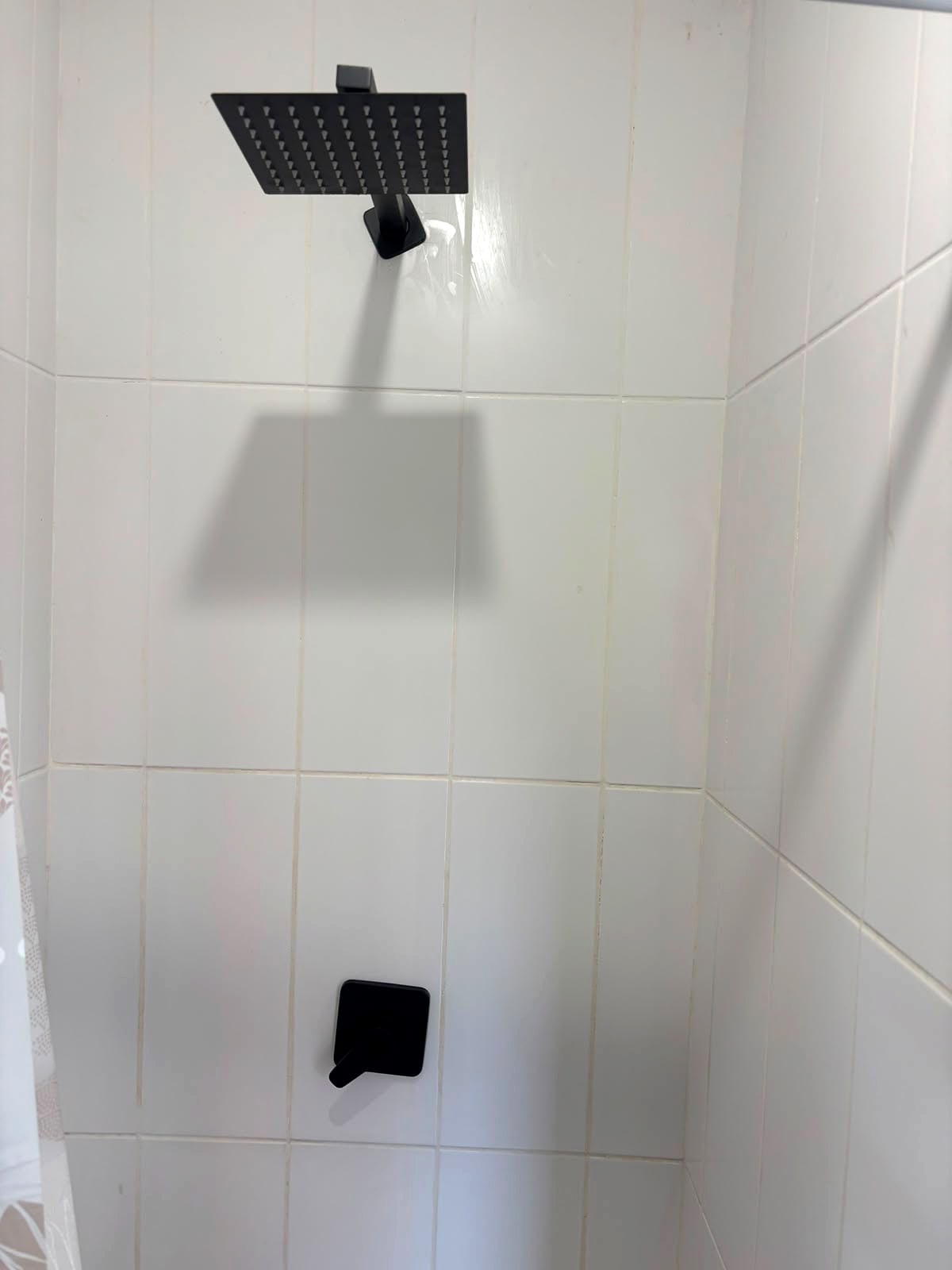 A 12A shower with a black rain shower head