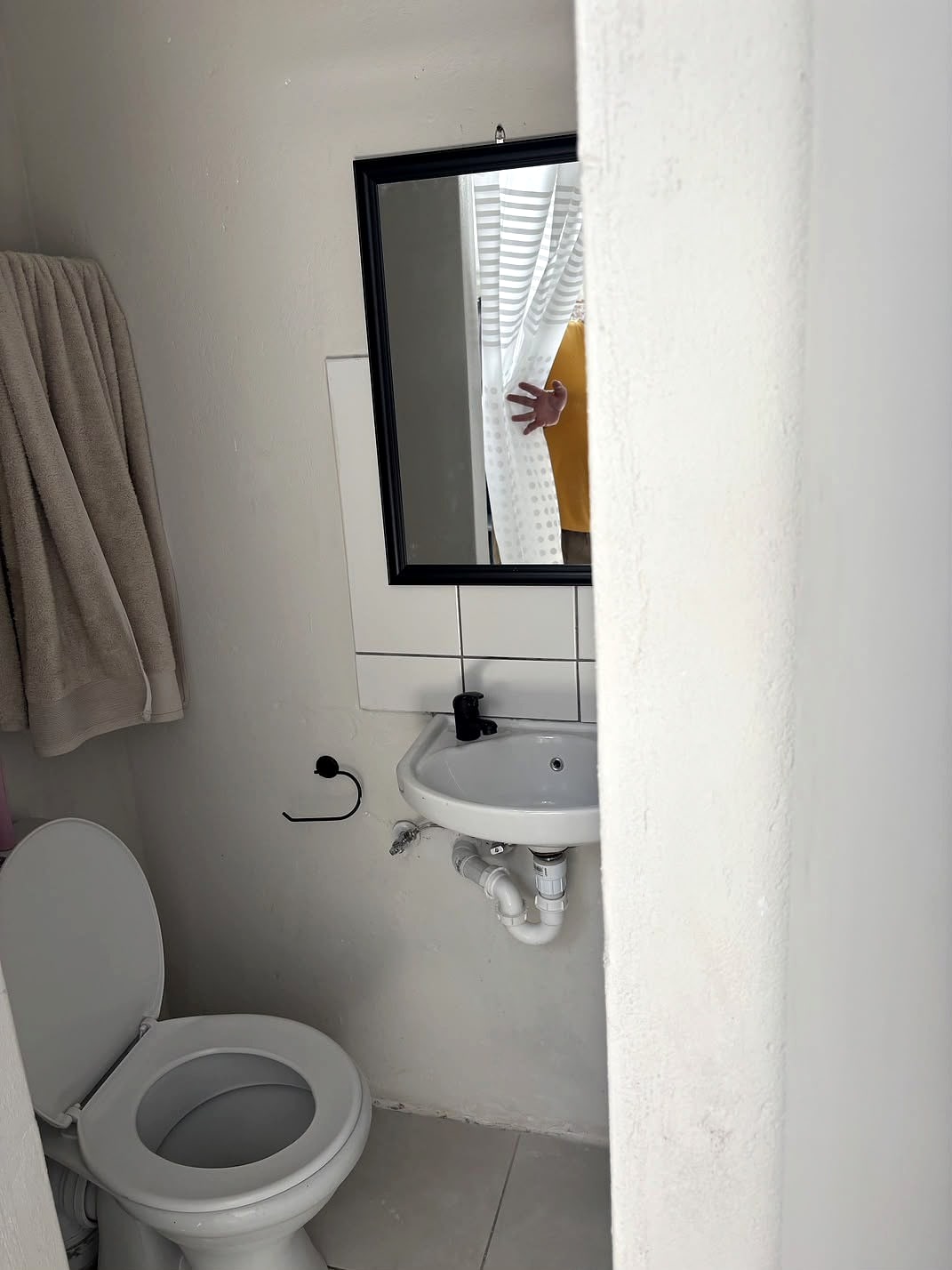 A 12A bathroom with a basin and mirror